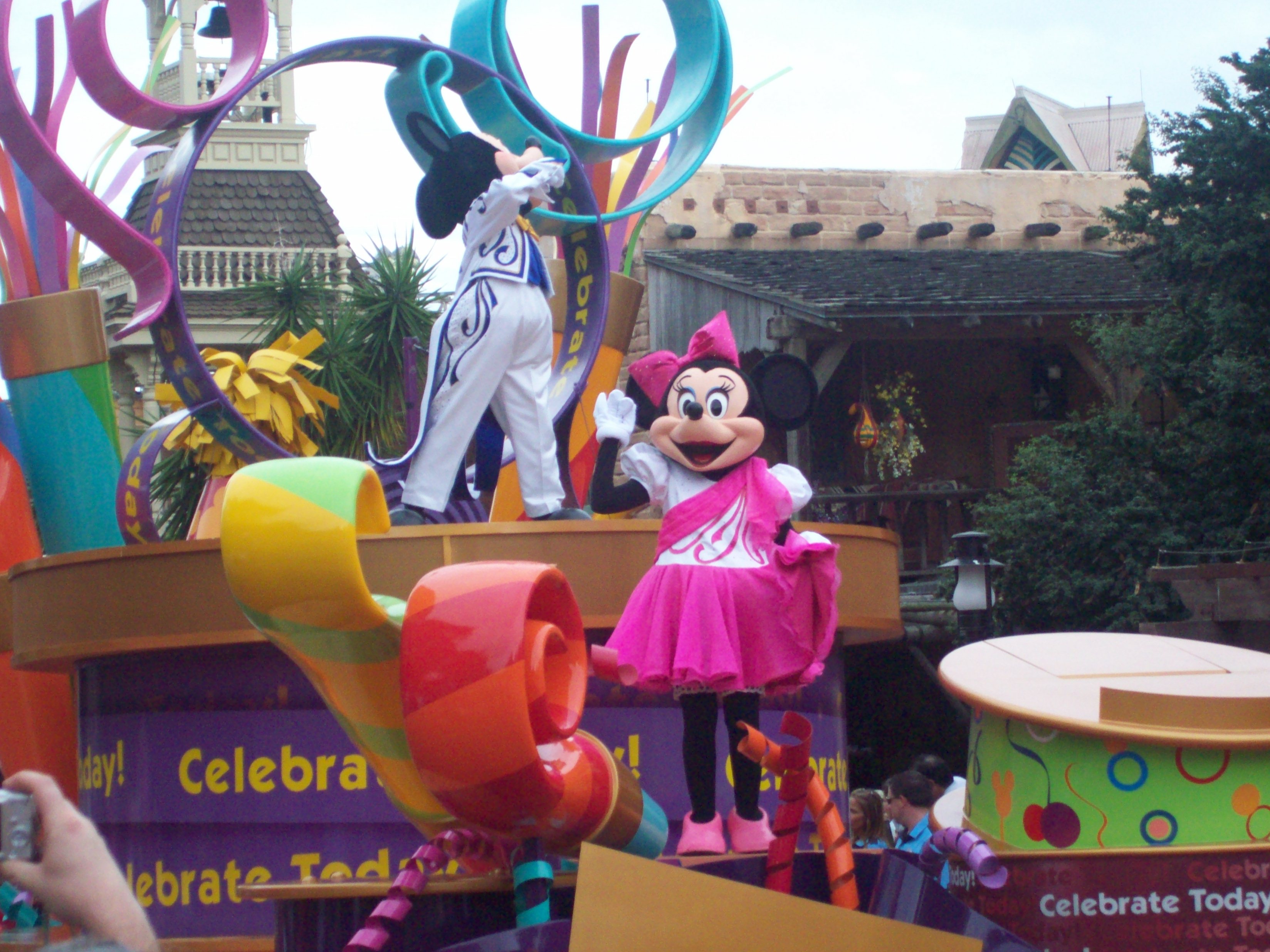 Mickey Mouse and Minnie Mouse on a float during a disney parade