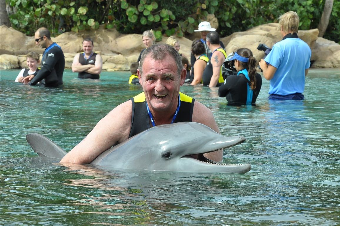 David in the water with a dolphin